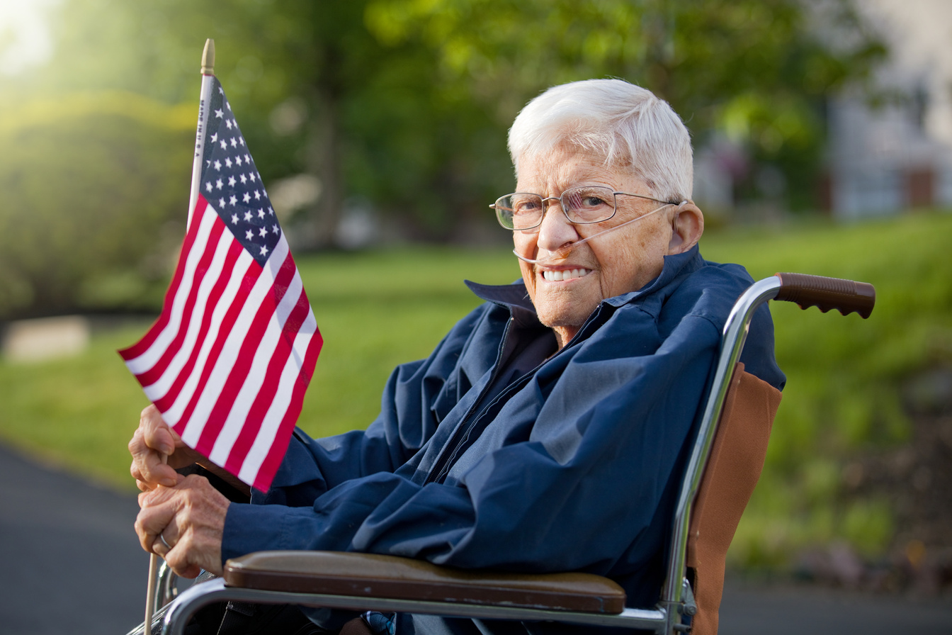 Proud Senior Man Veteran Holing US Flag
